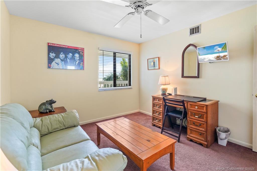 40 Northeast Plantation Road, Unit 415 Stuart, FL 34996 - Photo 20 of 32 a living room with furniture and a window