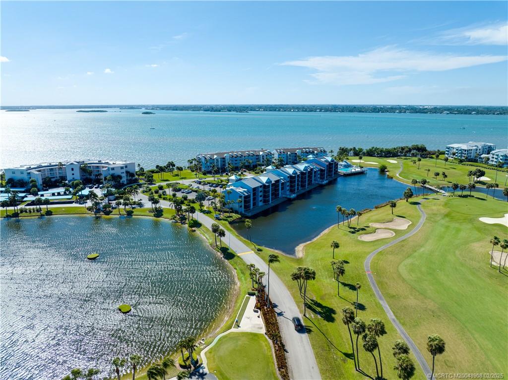 40 Northeast Plantation Road, Unit 415 Stuart, FL 34996 - Photo 29 of 32 a view of a swimming pool with an ocean view