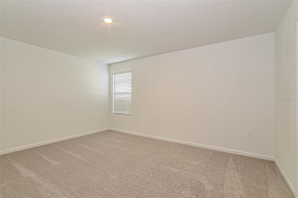 2207 Chris Drive Lake Wales, FL 33859 - Photo 6 of 16 an empty room with a empty space and windows