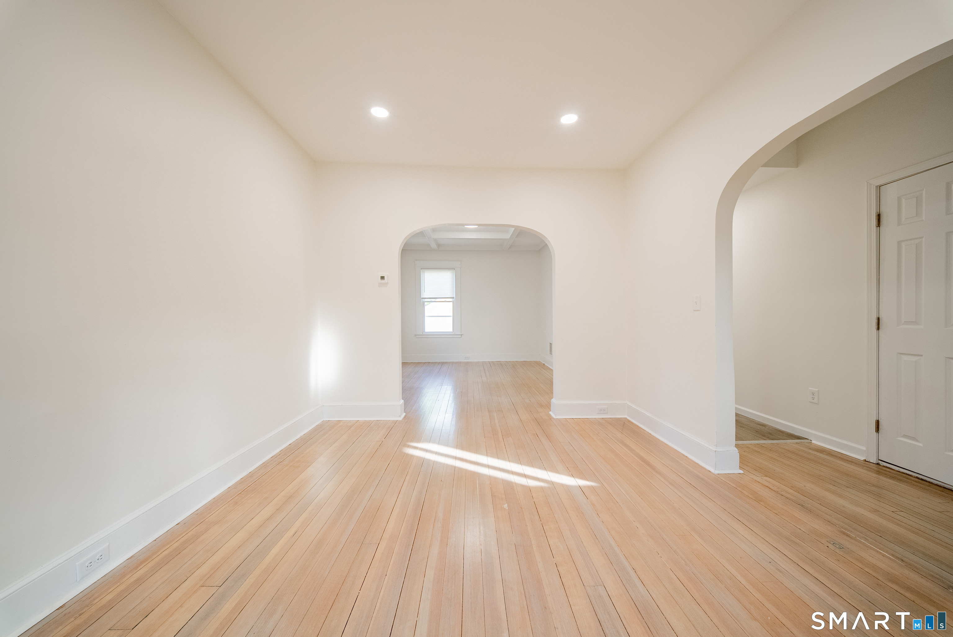 50 Jones Street West Haven, CT 06516 - Photo 6 of 21 a view of empty room with wooden floor