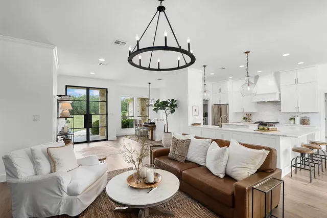 a bed room with a bed and a large window