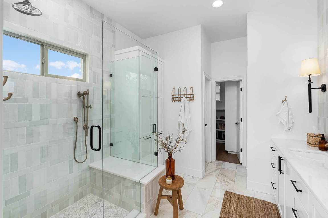 1921 Ruby Ranch Road Buda, TX 78610 - Photo 18 of 36 a bathroom with a bathtub and shower