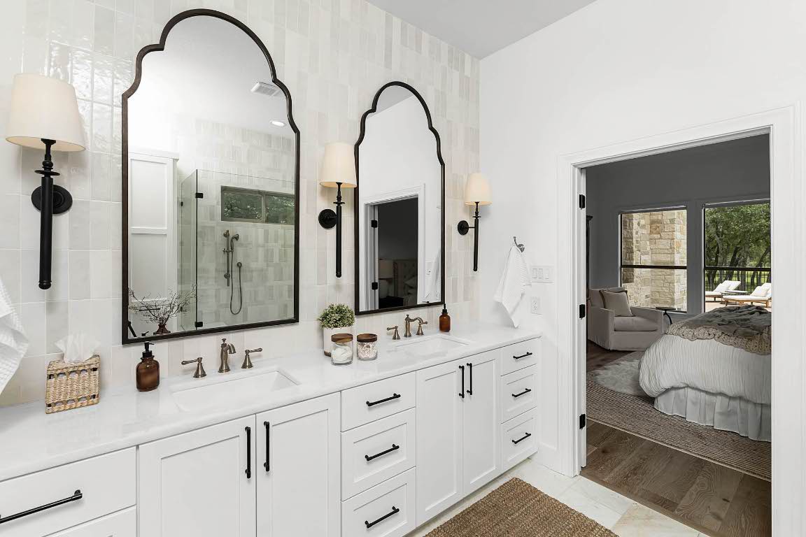 1921 Ruby Ranch Road Buda, TX 78610 - Photo 20 of 36 a en suite bathroom with a granite countertop sink and mirror