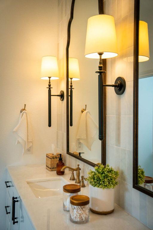 1921 Ruby Ranch Road Buda, TX 78610 - Photo 21 of 36 a bathroom with a sink and a mirror