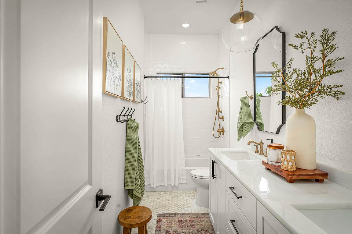 1921 Ruby Ranch Road Buda, TX 78610 - Photo 24 of 36 a bathroom with a granite countertop sink a toilet and mirror
