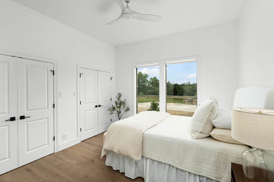 1921 Ruby Ranch Road Buda, TX 78610 - Photo 25 of 36 a bedroom with a bed and a large window