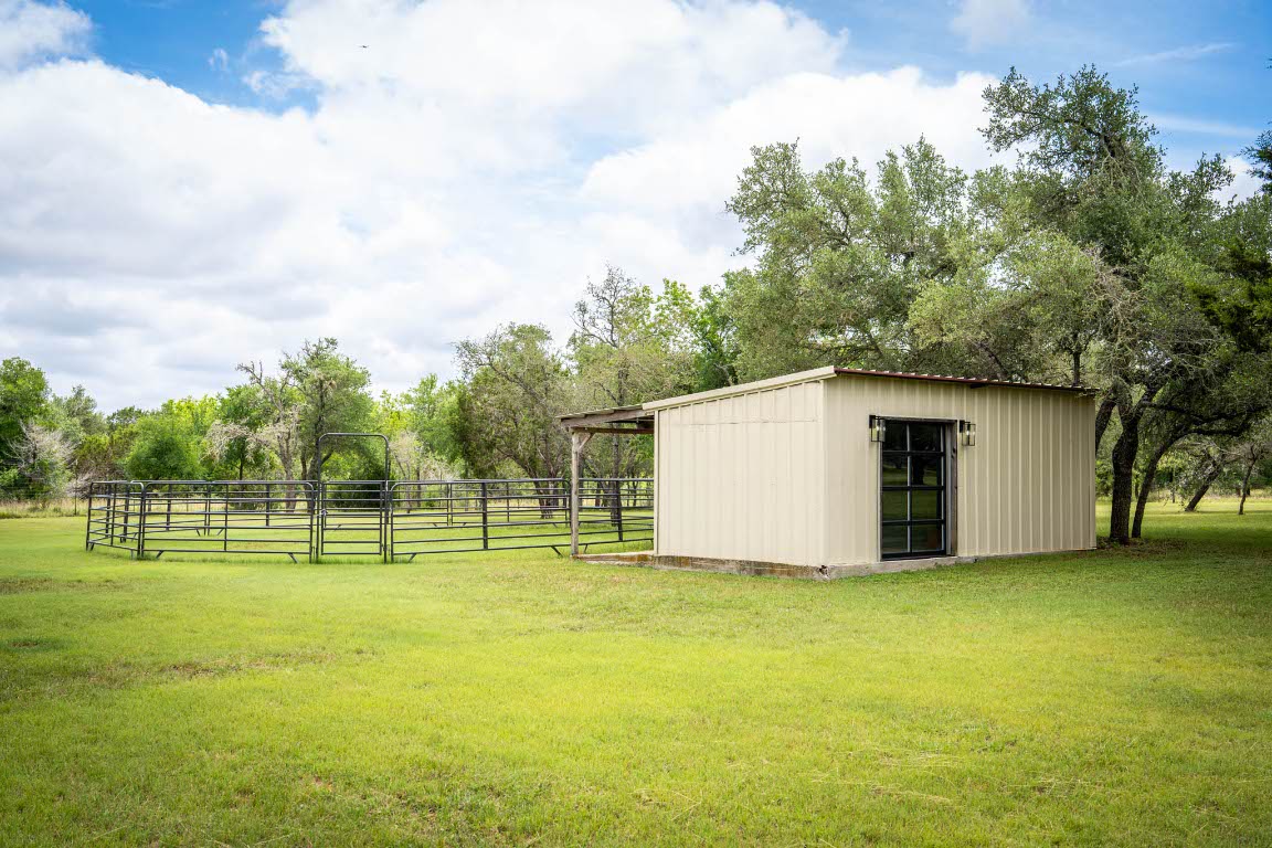 1921 Ruby Ranch Road Buda, TX 78610 - Photo 26 of 36 a house with swimming pool in front of it