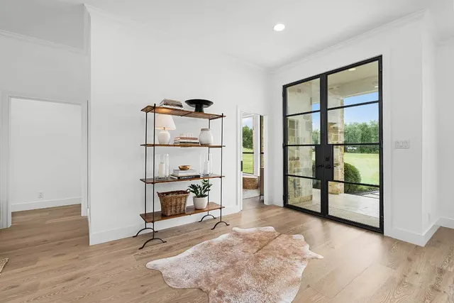 a view of a livingroom with furniture and a window