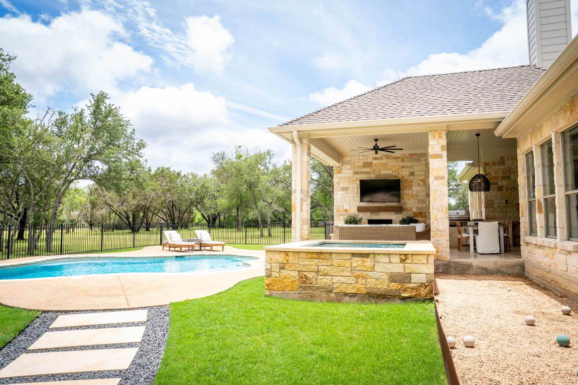 1921 Ruby Ranch Road Buda, TX 78610 - Photo 32 of 36 a view of a house with swimming pool and a yard
