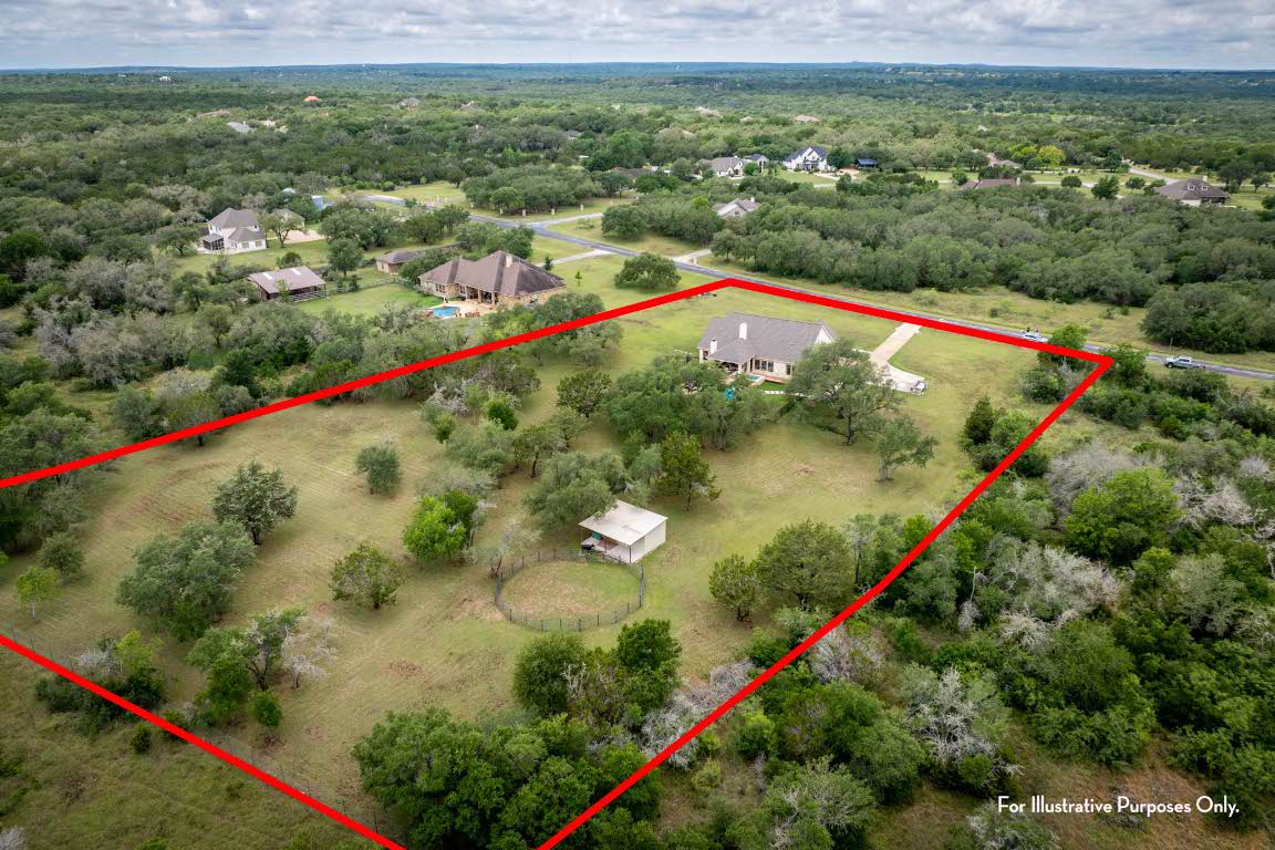 1921 Ruby Ranch Road Buda, TX 78610 - Photo 34 of 36 a view of a lush green field