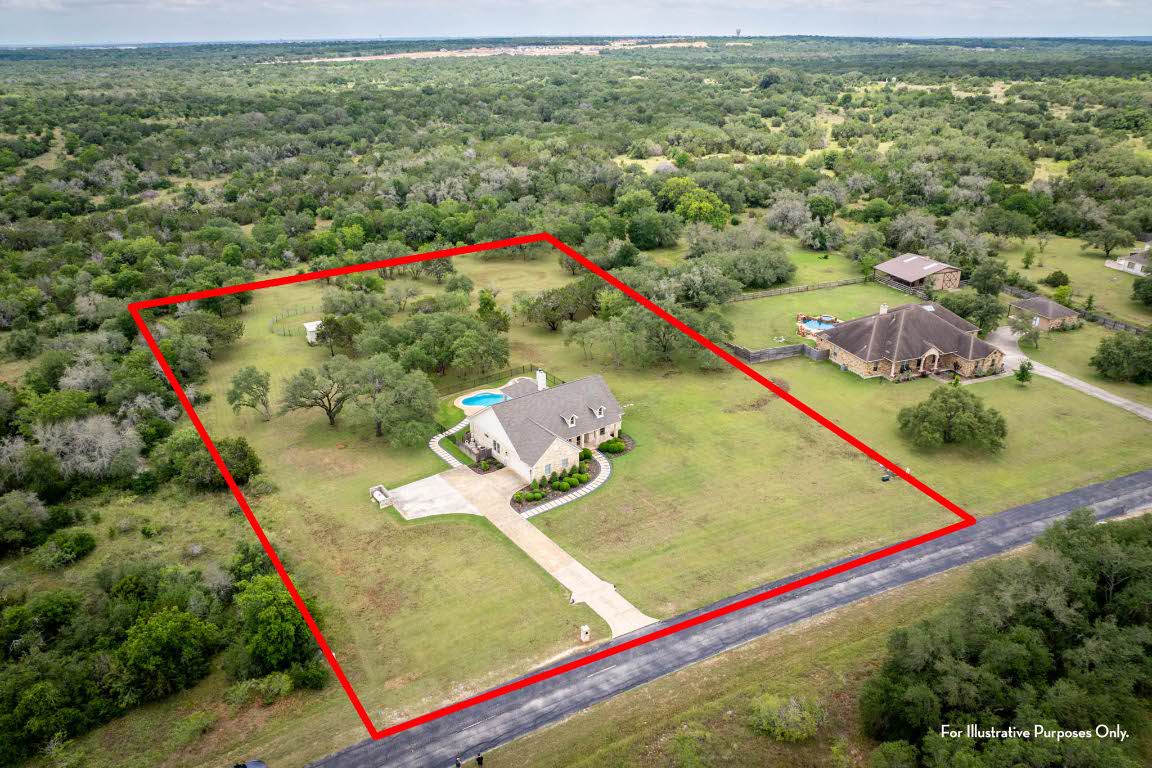 1921 Ruby Ranch Road Buda, TX 78610 - Photo 35 of 36 a view of a lush green field