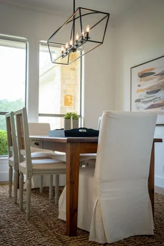 a room with a table and a window