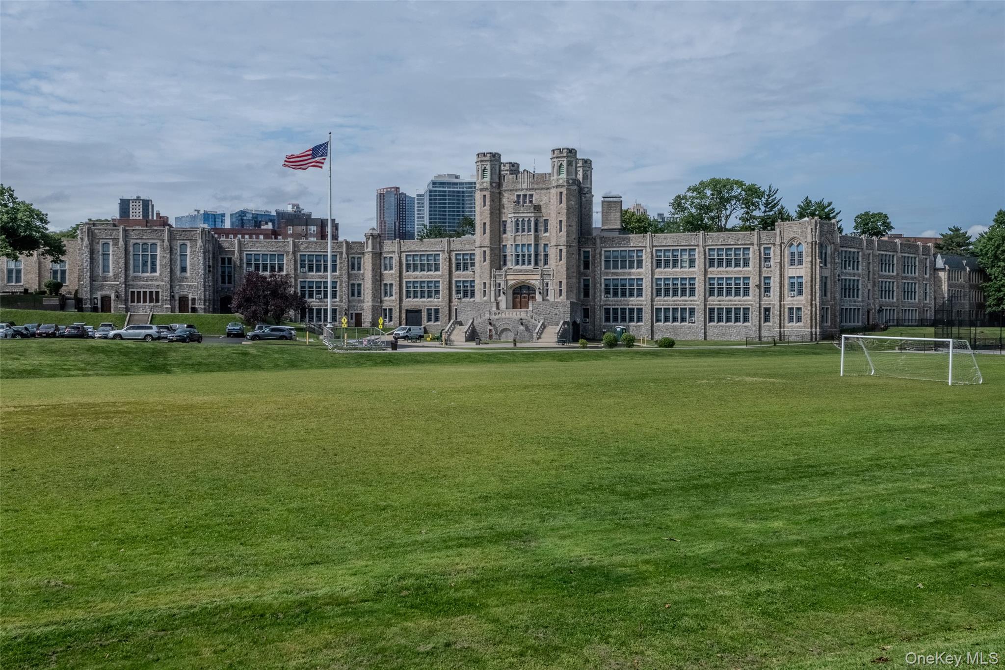 90 Union Street, Unit 1A New Rochelle, NY 10805 - Photo 24 of 28 a view of a building with a big yard and a large trees