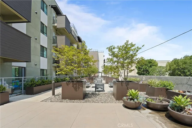 a lobby with furniture and a potted plant