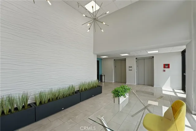 a living room with furniture flat screen tv and wooden floor