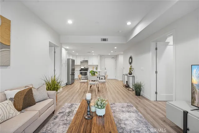 a living room with furniture and a rug