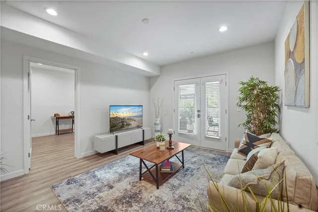 a living room with furniture rug and window