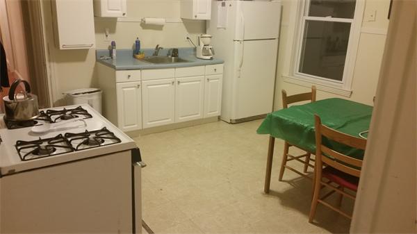 35 Waverly Street, Unit B Boston, MA 02135 - Photo 8 of 13 a kitchen with stainless steel appliances granite countertop a stove and a refrigerator