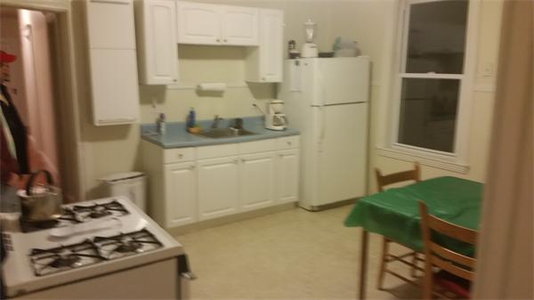 35 Waverly Street, Unit B Boston, MA 02135 - Photo 9 of 13 a kitchen with a stove and a refrigerator