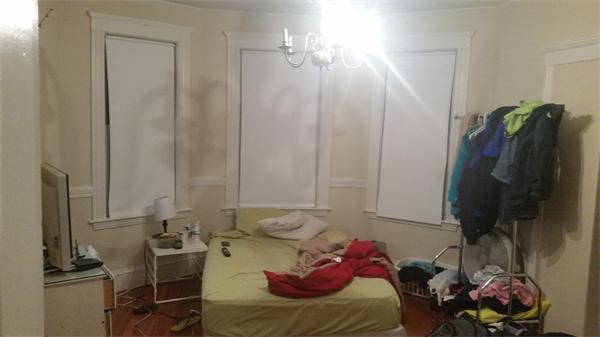 35 Waverly Street, Unit B Boston, MA 02135 - Photo 10 of 13 a living room with furniture and a flat screen tv