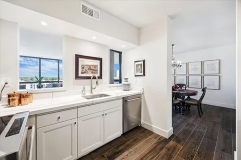 a living room with furniture or couch and a potted plant