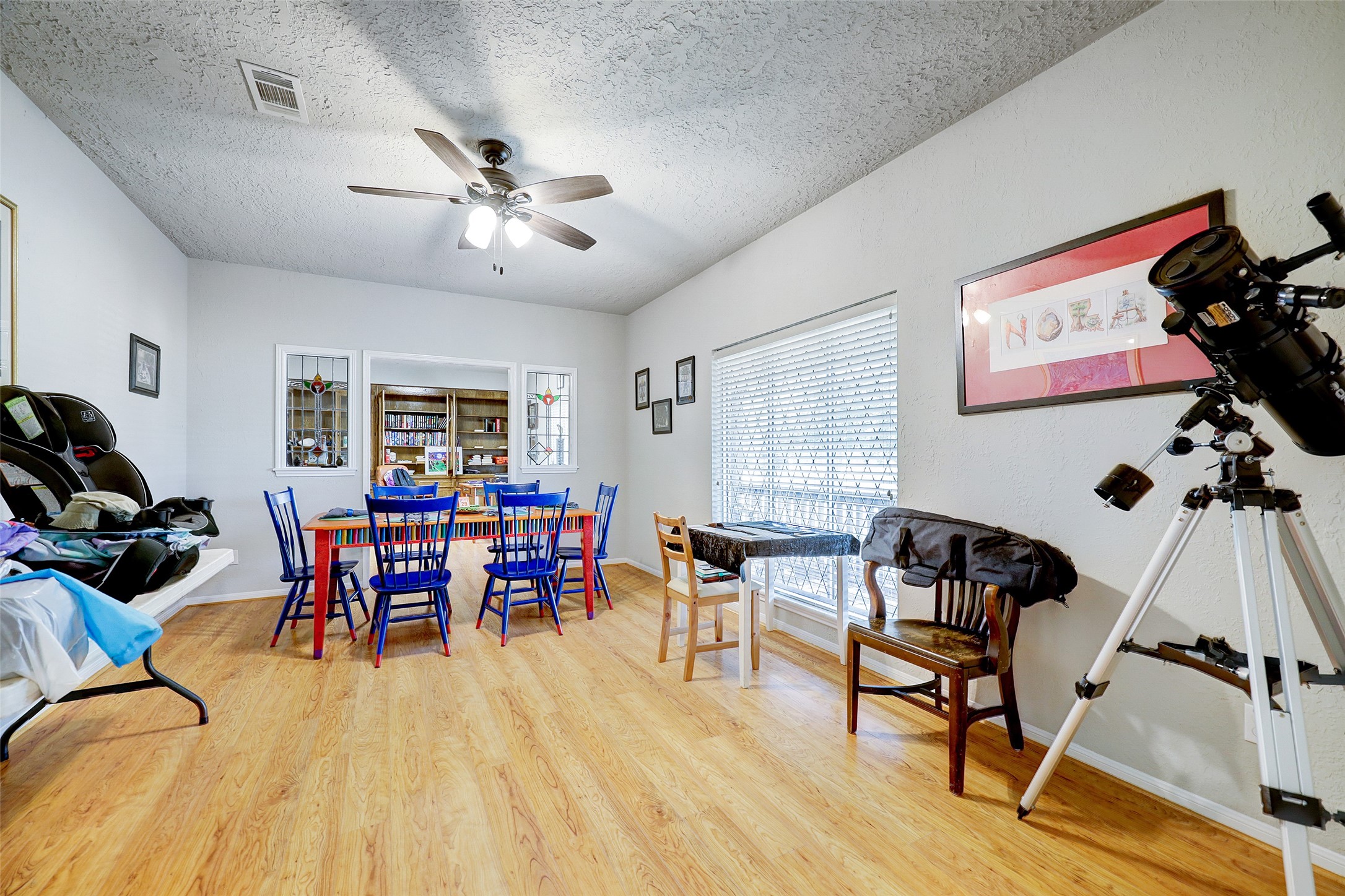 1664 North McCaleb Road Montgomery, TX 77316 - Photo 12 of 23 a dining room with furniture and wooden floor
