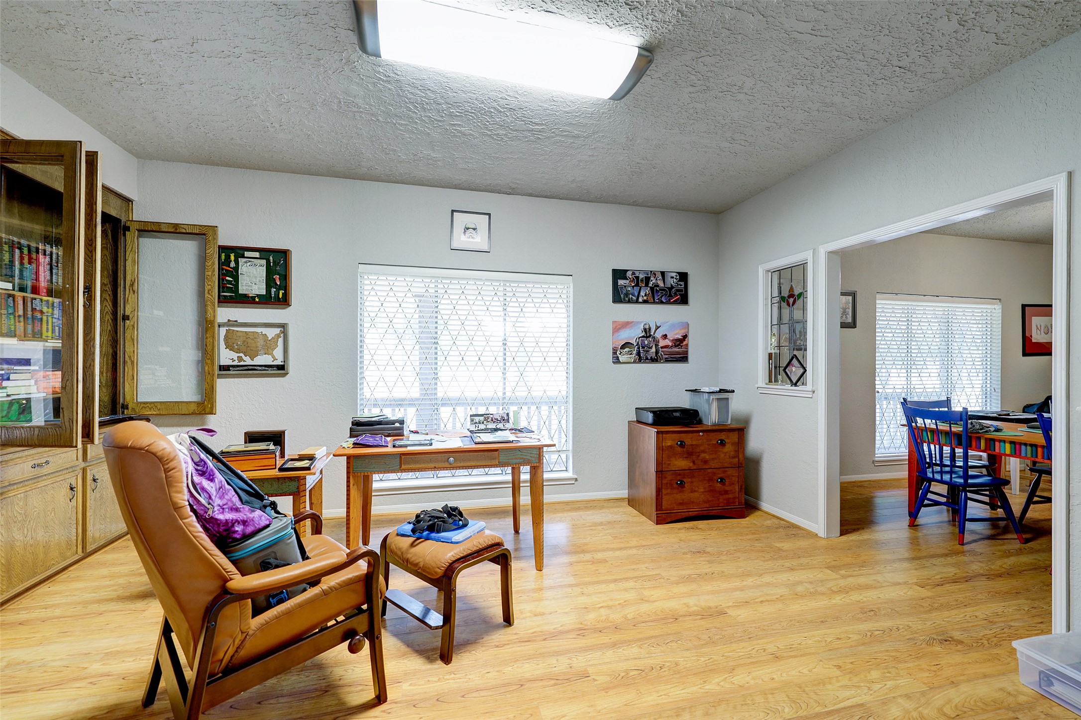 1664 North McCaleb Road Montgomery, TX 77316 - Photo 13 of 23 a living room with furniture and a flat screen tv