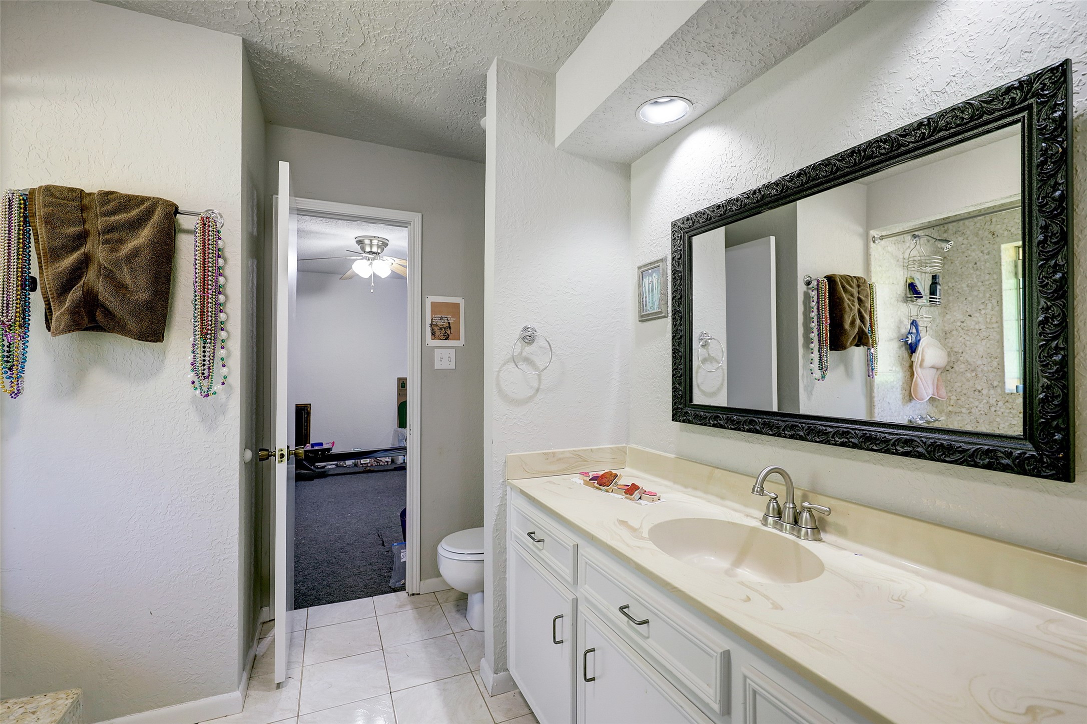 1664 North McCaleb Road Montgomery, TX 77316 - Photo 22 of 23 a en suite bathroom with a sink and mirror