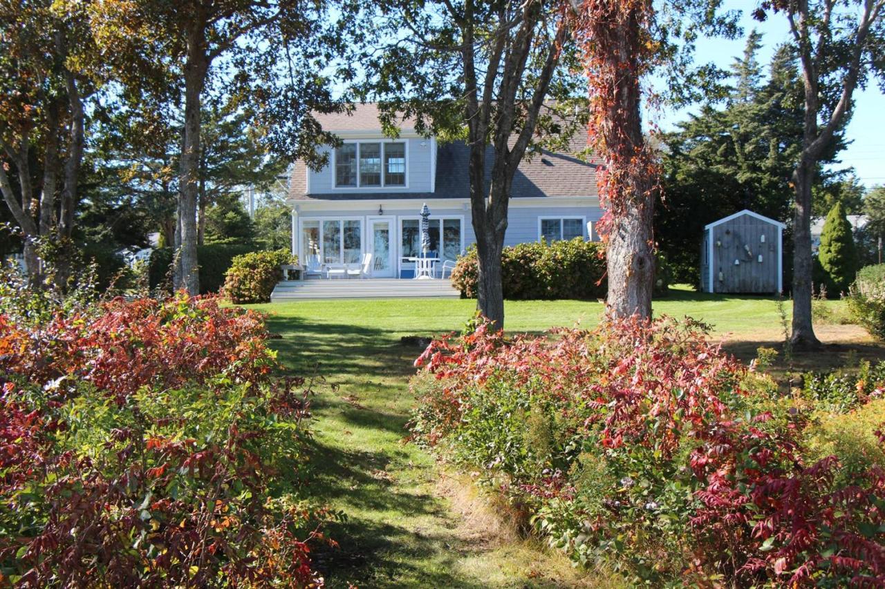 206 Clipper Road Bourne, MA 02532 - Photo 13 of 35 front view of a house with a yard