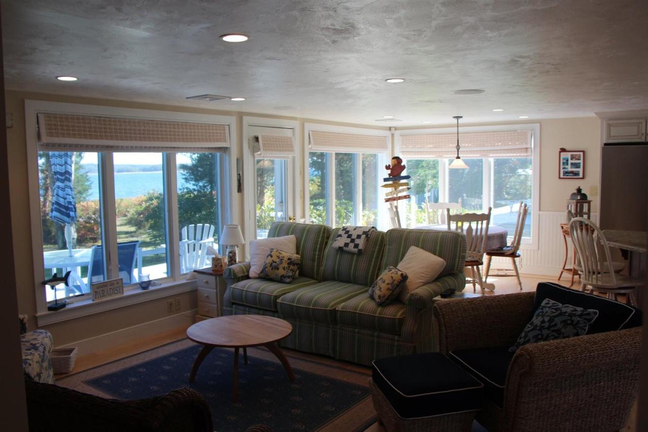 206 Clipper Road Bourne, MA 02532 - Photo 15 of 35 a living room with furniture and a flat screen tv