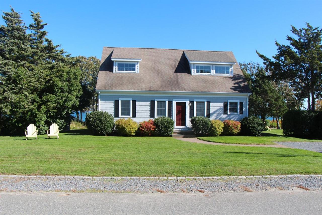 206 Clipper Road Bourne, MA 02532 - Photo 2 of 35 a front view of a house with a yard