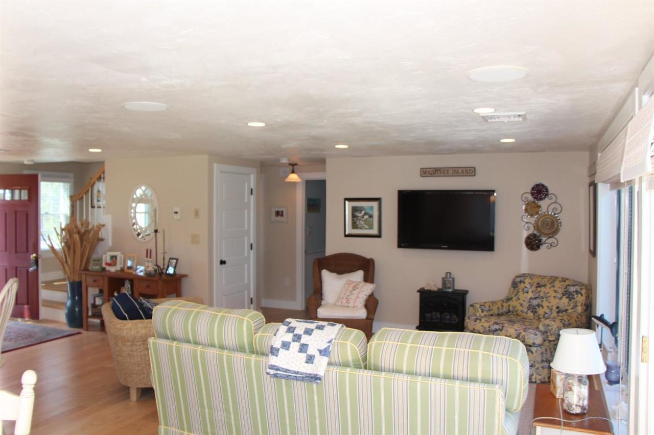 206 Clipper Road Bourne, MA 02532 - Photo 24 of 35 a living room with furniture and a flat screen tv
