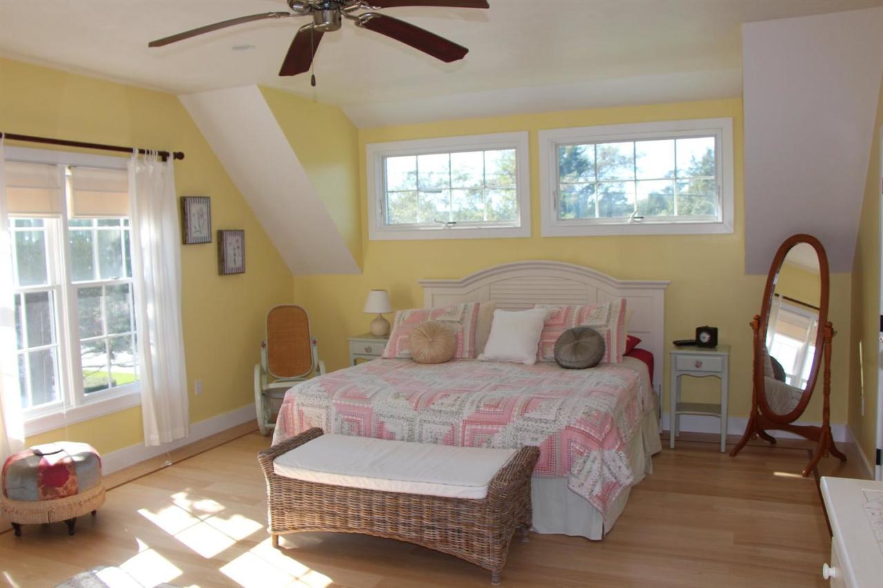 206 Clipper Road Bourne, MA 02532 - Photo 30 of 35 a bedroom with a bed a couch and a window