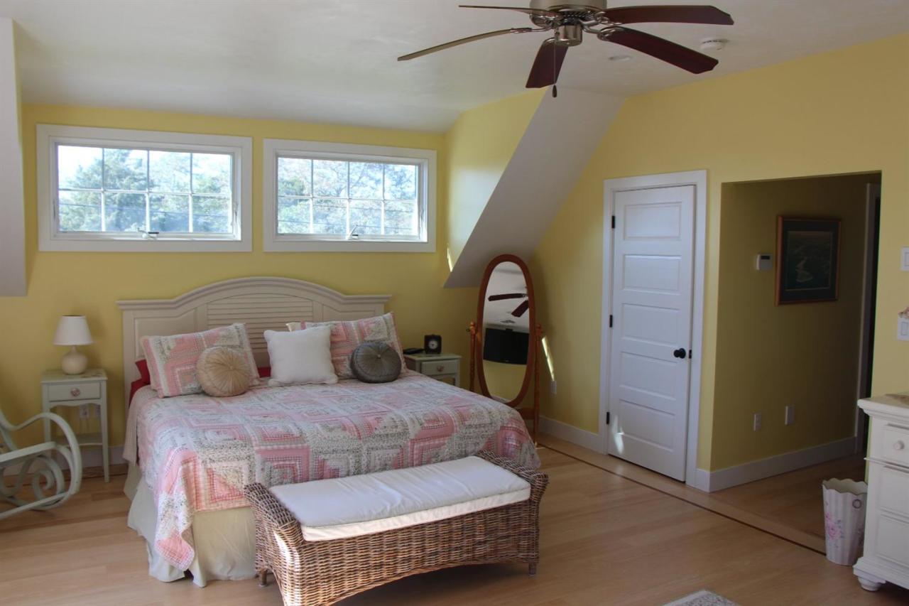 206 Clipper Road Bourne, MA 02532 - Photo 31 of 35 a living room with a bed furniture and a window
