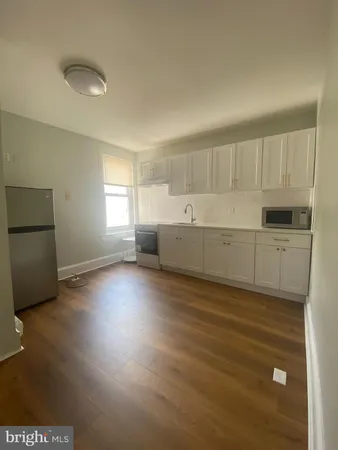 a view of kitchen and windows