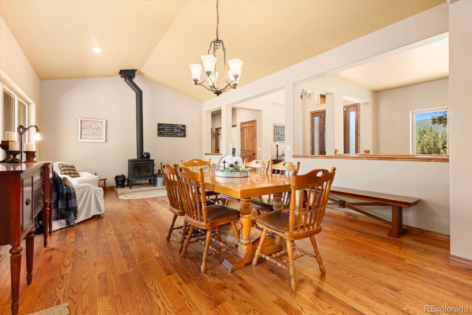 990 Hamilton Creek Road Coaldale, CO 81222 - Photo 9 of 49 a view of a dining room with furniture and wooden floor