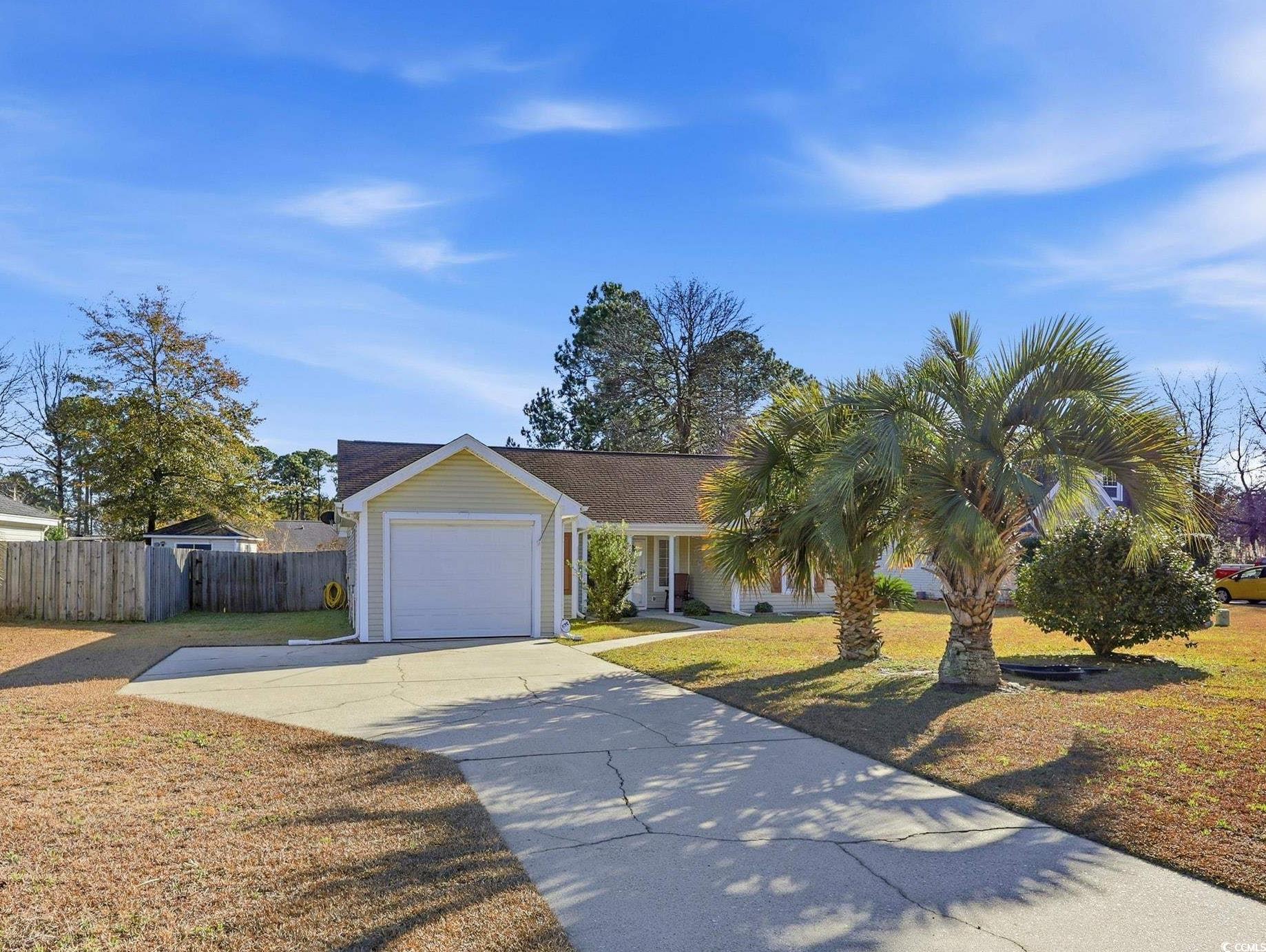 2560 Wild Game Trail Myrtle Beach, SC 29588 - Photo 1 of 24 View of front of house with driveway and a garage