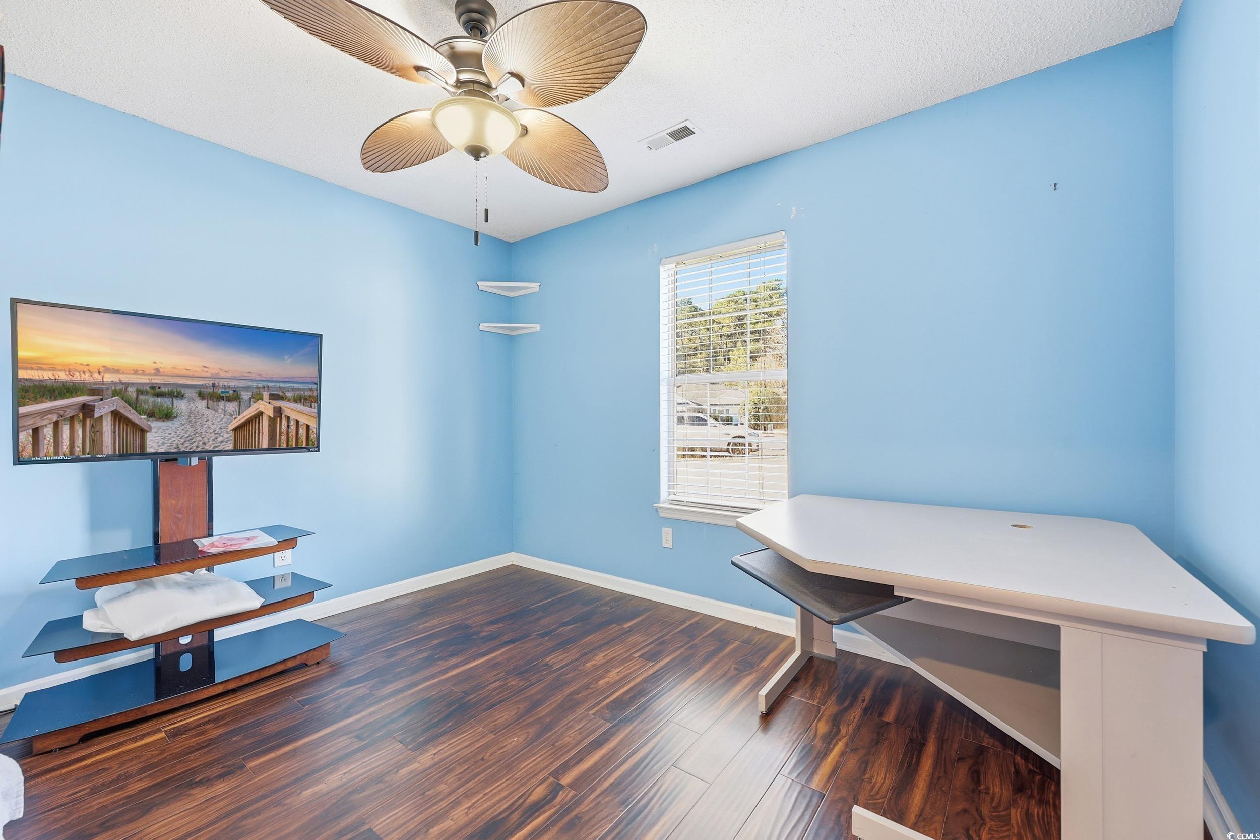 2560 Wild Game Trail Myrtle Beach, SC 29588 - Photo 15 of 24 Unfurnished office featuring dark wood finished floors, a ceiling fan, and a textured ceiling