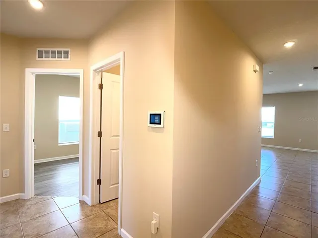 a view of a hallway with a room