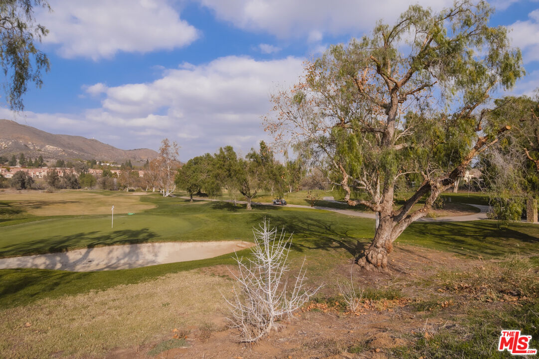 552 Fairfield Road Simi Valley, CA 93065 - Photo 11 of 13 a view of a lake with houses in the back