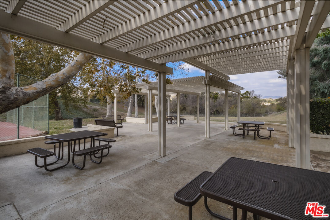 552 Fairfield Road Simi Valley, CA 93065 - Photo 12 of 13 a view of a patio with table and chairs and potted plants