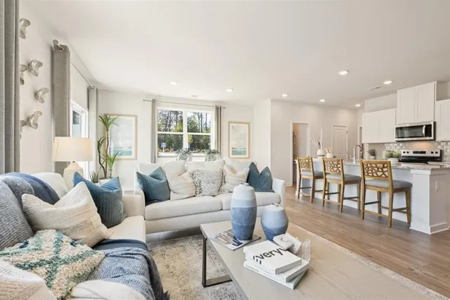 a living room with furniture and a large window