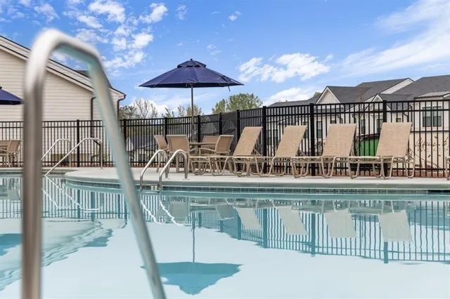 a view of a swimming pool with a terrace