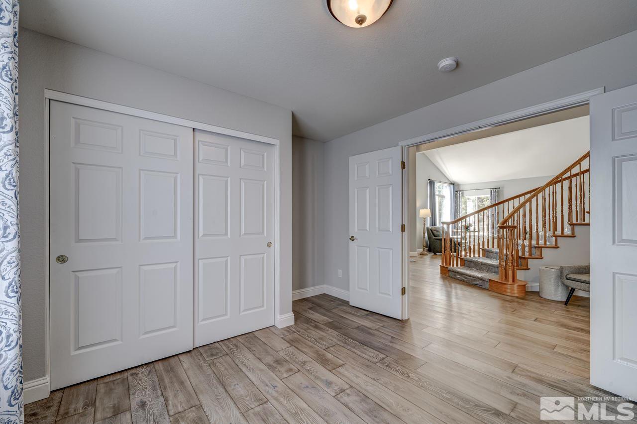 14435 Ghost Rider Drive Reno, NV 89511 - Photo 19 of 30 a view of entryway and hall with wooden floor