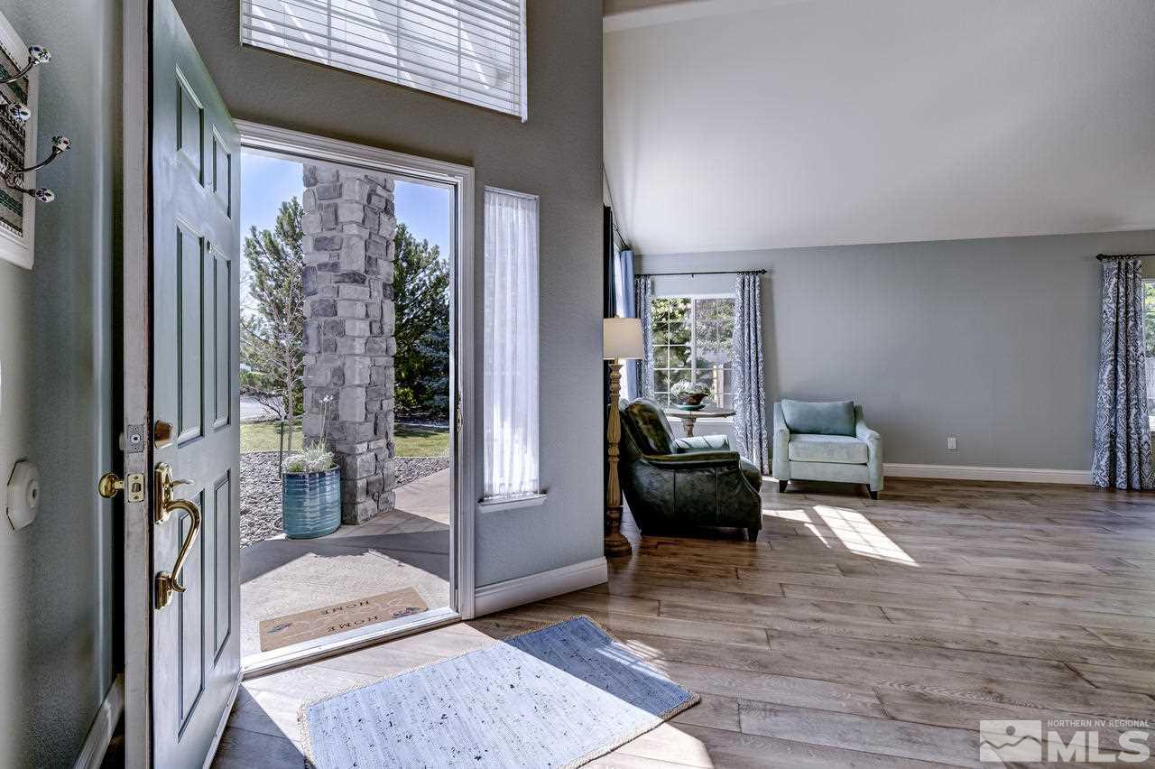 14435 Ghost Rider Drive Reno, NV 89511 - Photo 2 of 30 a living room with furniture and a window