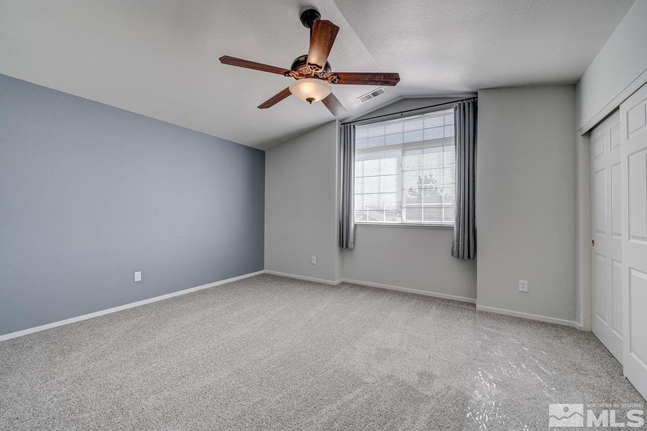 14435 Ghost Rider Drive Reno, NV 89511 - Photo 21 of 30 a view of an empty room with a window