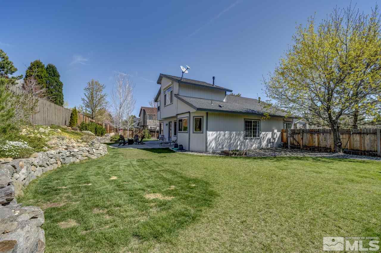 14435 Ghost Rider Drive Reno, NV 89511 - Photo 29 of 30 a front view of a house with a garden