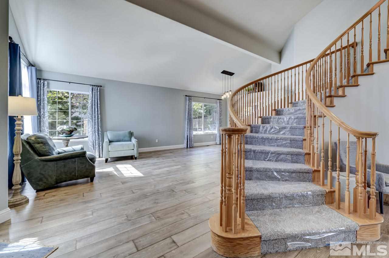 14435 Ghost Rider Drive Reno, NV 89511 - Photo 3 of 30 a view of entryway and hall with wooden floor