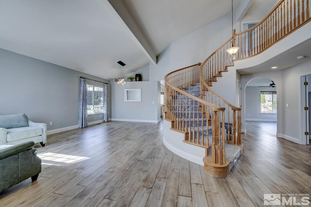 14435 Ghost Rider Drive Reno, NV 89511 - Photo 5 of 30 a view of entryway and hall with wooden floor