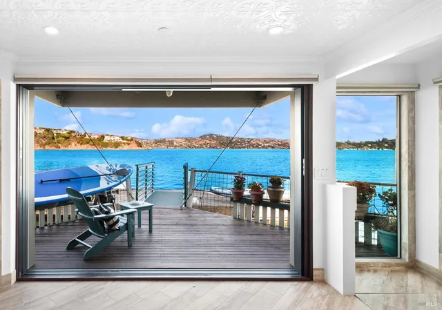a view of a living room and dining room with furniture